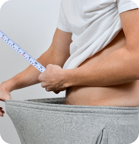 Man measuring his waist